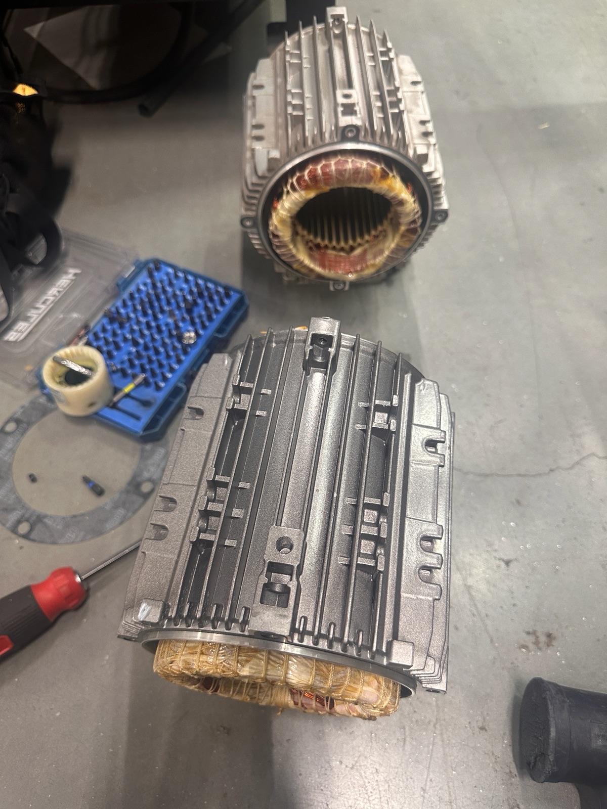 Motor teardown showing burned stator windings versus replacement